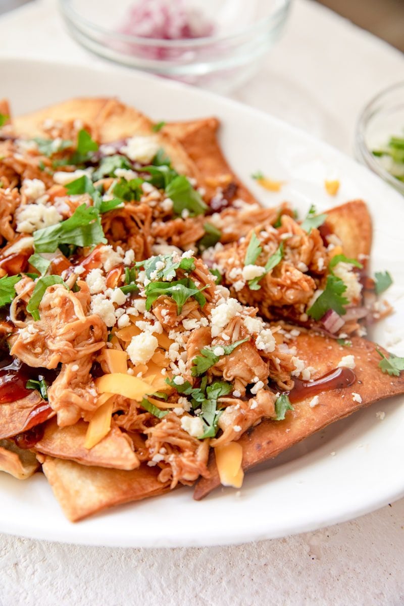 bbq chicken nachos with green onion topping