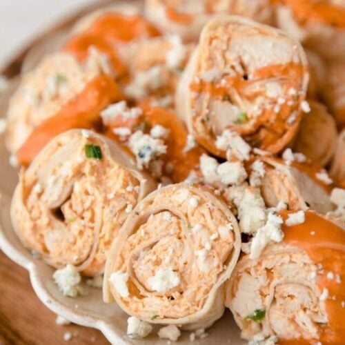 buffalo chicken pinwheels topped with blue cheese