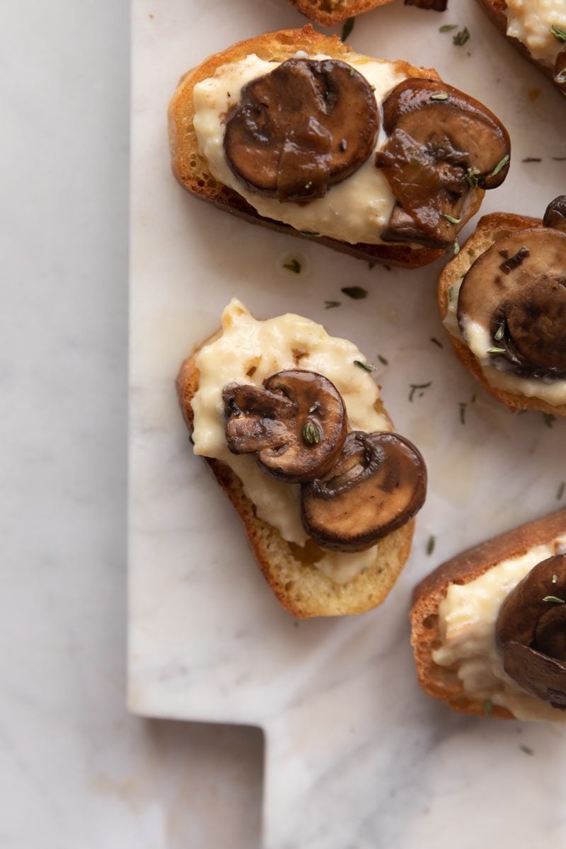 close up photo of mushrooms on toast with parmesan cream