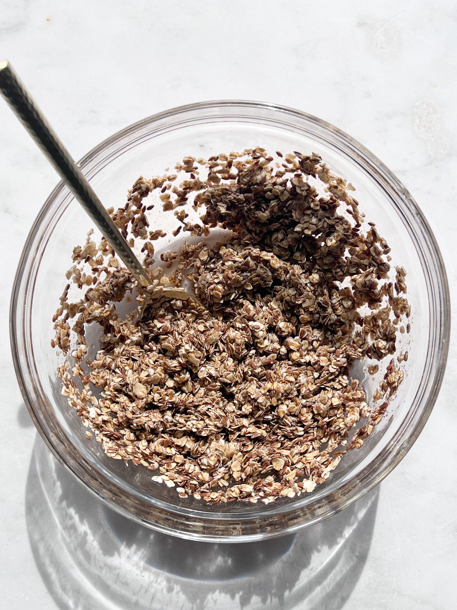 all ingredients in a glass mixing bowl with a spoon