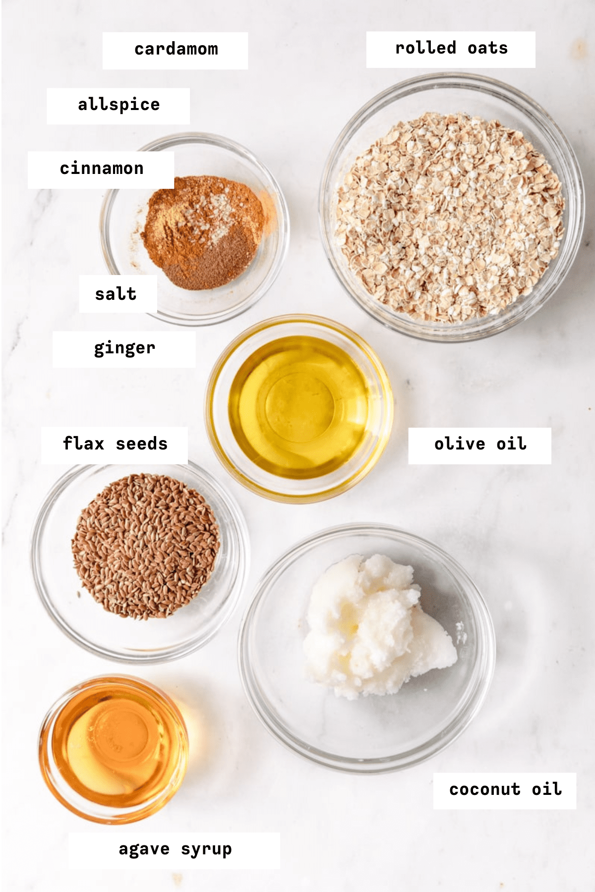 Granola butter ingredients in glass bowls. 