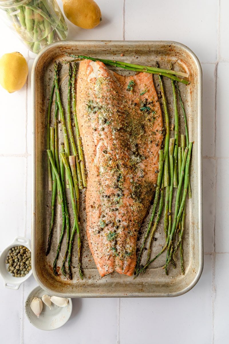 overhead photo of a full salmon fillet on a sheet tray