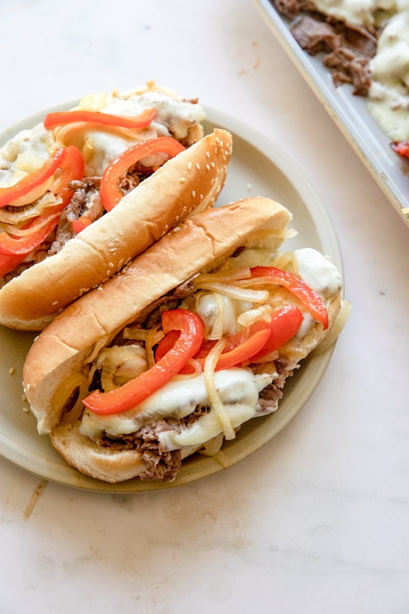 overhead photo of two sheet pan Philly cheesesteaks