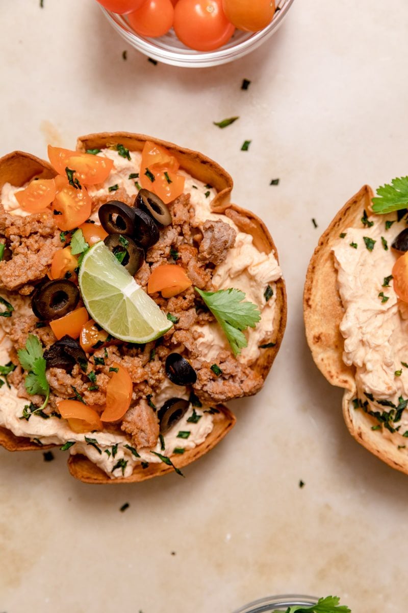 overhead photo of taco dip in taco bowls