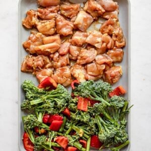 overhead photo of teriyaki chicken and veggies on a sheet pan
