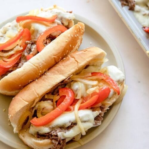 overhead photo of two sheet pan Philly cheesesteaks