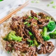 A close-up shot of a dish of shaved beef stir fry.