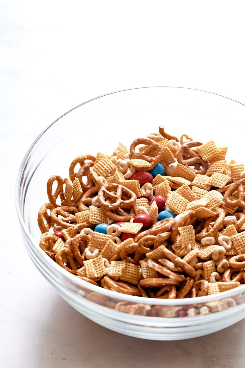 dry ingredients for 4th of July party mix in a mixing bowl