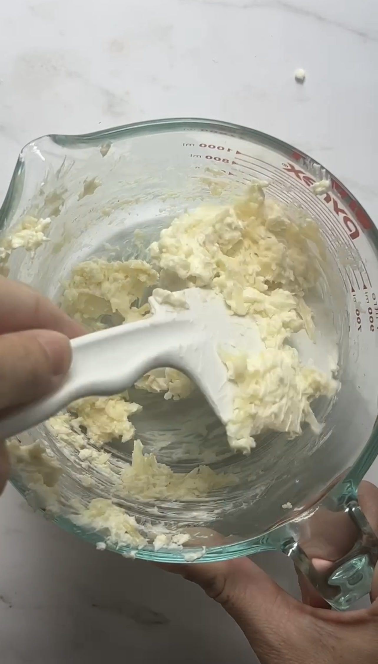 cheese mixture in a clear mixing bowl