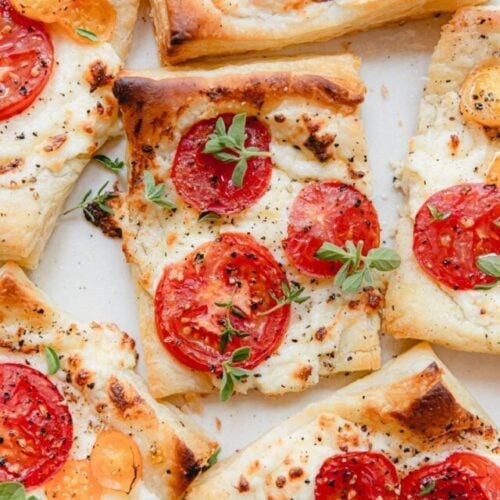 close up photo of baked tomato tarts with puff pastry