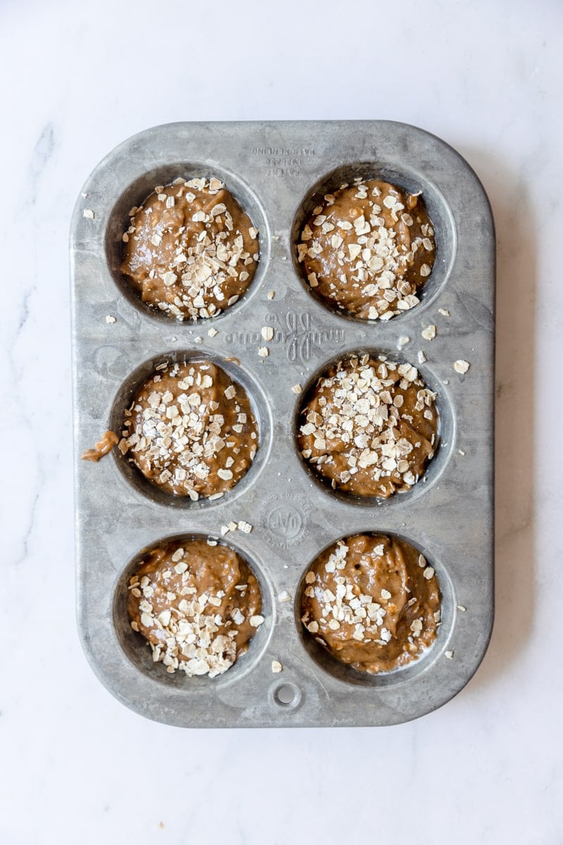 pumpkin banana muffin batter poured into 6 muffin cups