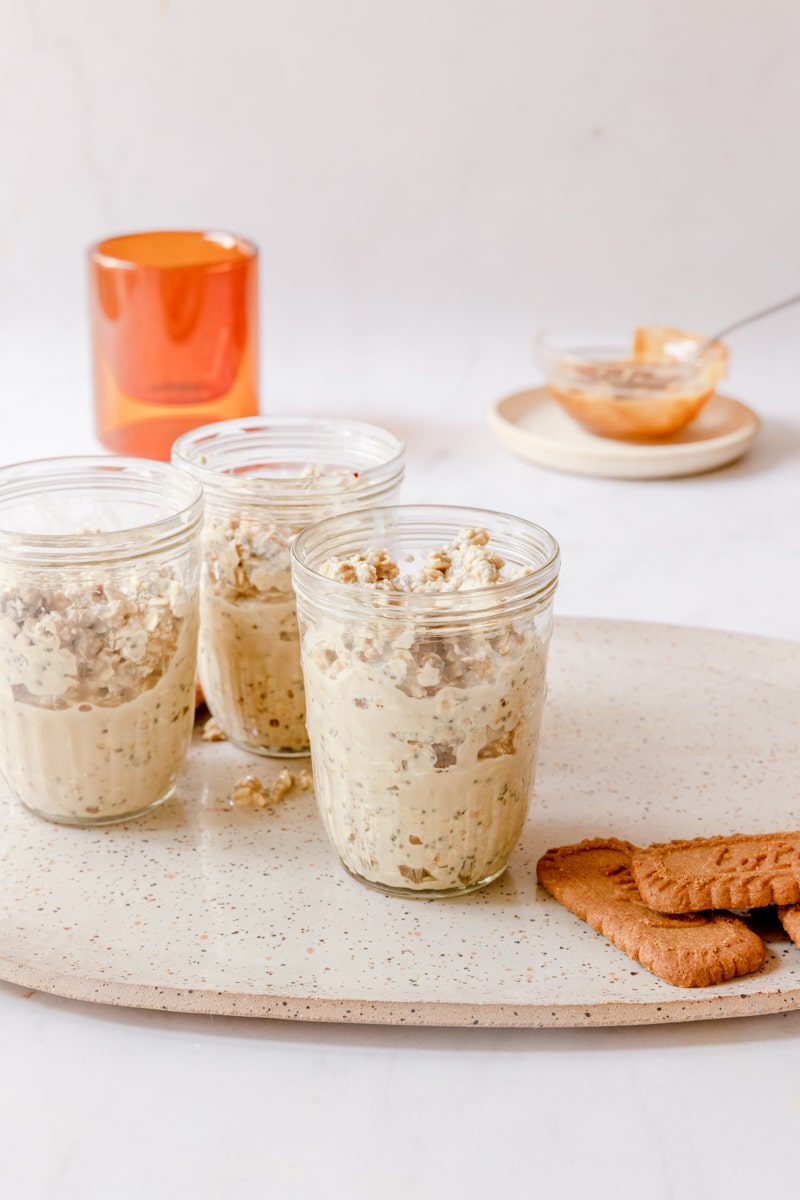 Overnight oat mixture poured into 3 small glass jars 