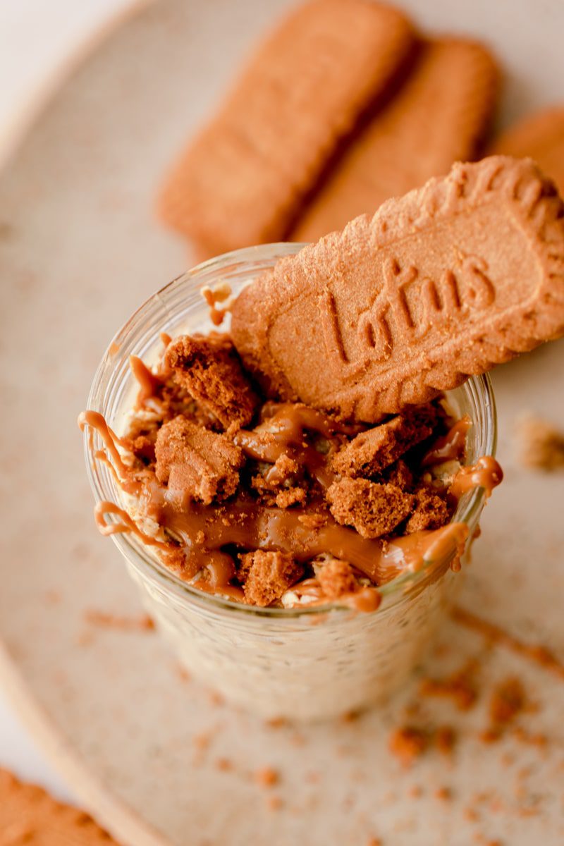 lotus biscoff cookie on top of a jar of overnight oats 