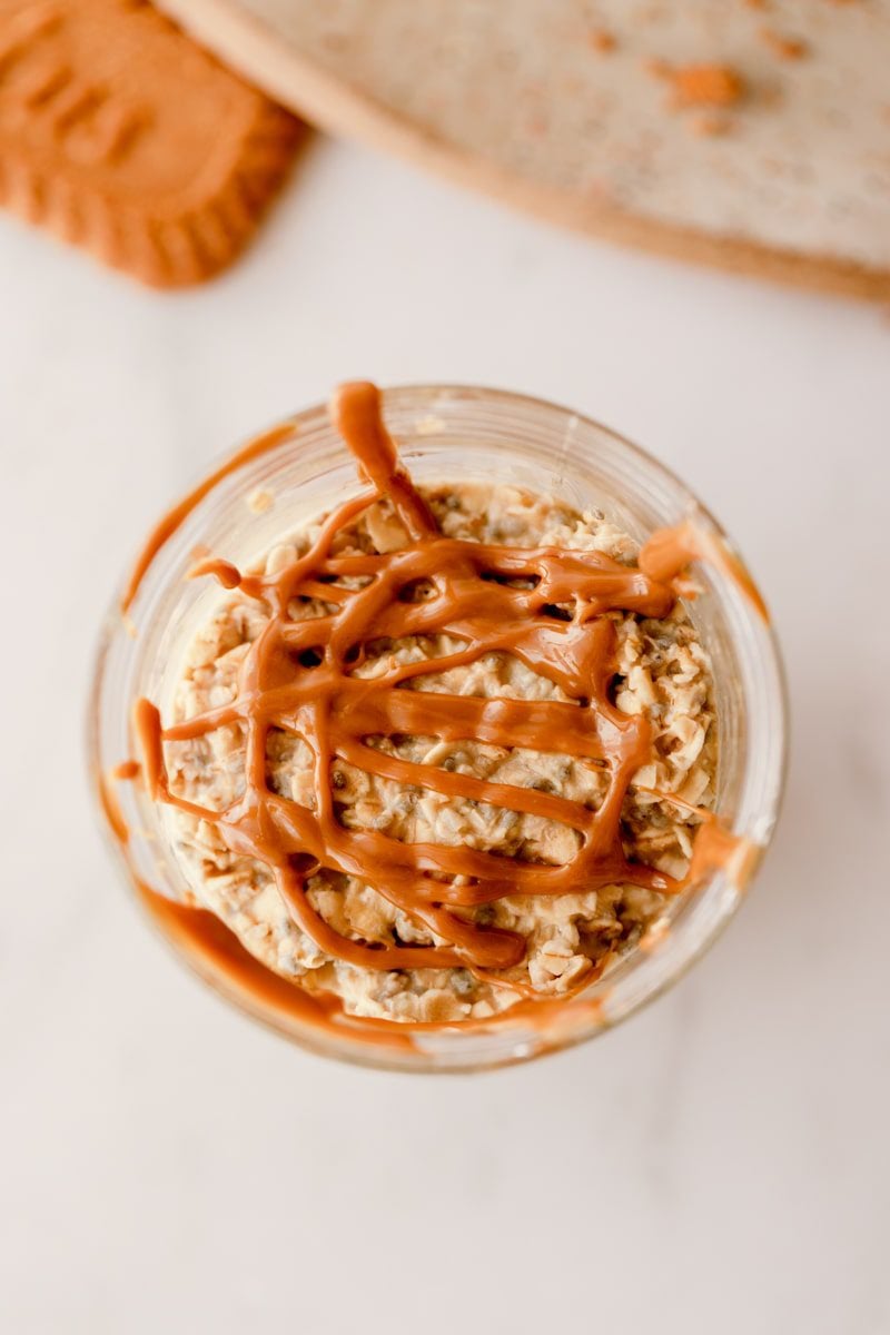 overhead photo of cookie butter overnight oats drizzled with extra cookie butter 