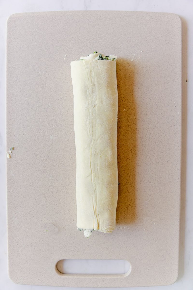 Puff pastry filled with spinach and ricotta rolled up