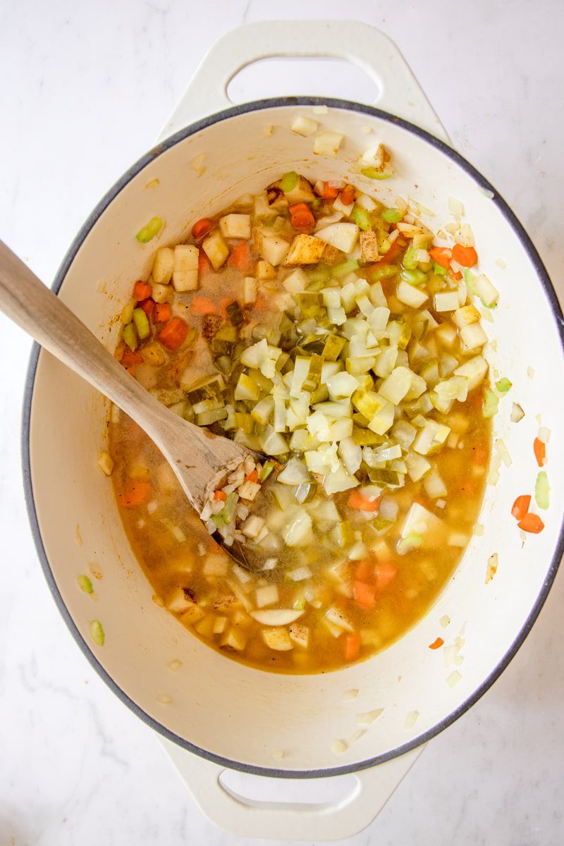 sautéed veggies, pickles, and broth added to the dutch oven