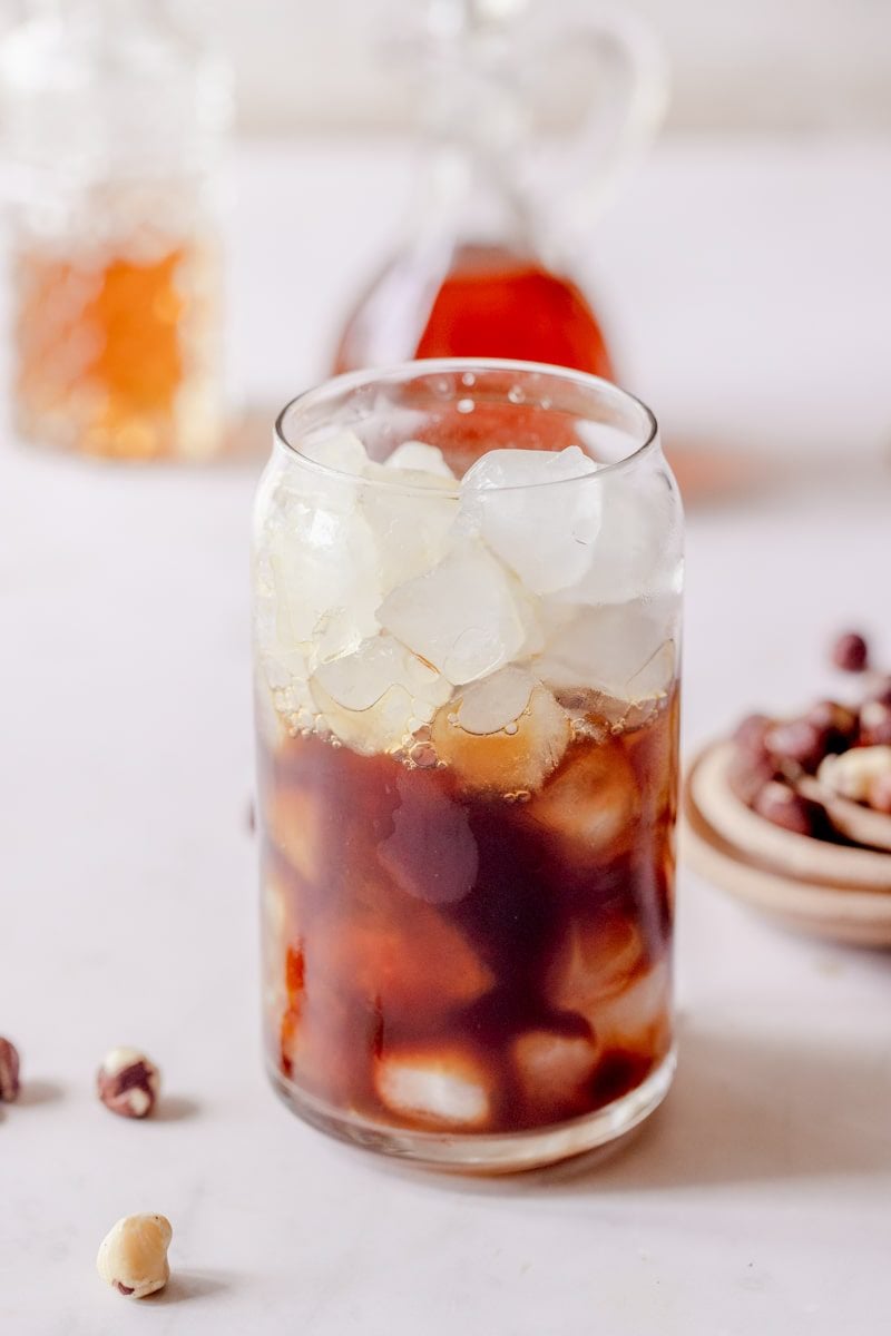 espresso and hazelnut syrup in a glass over ice