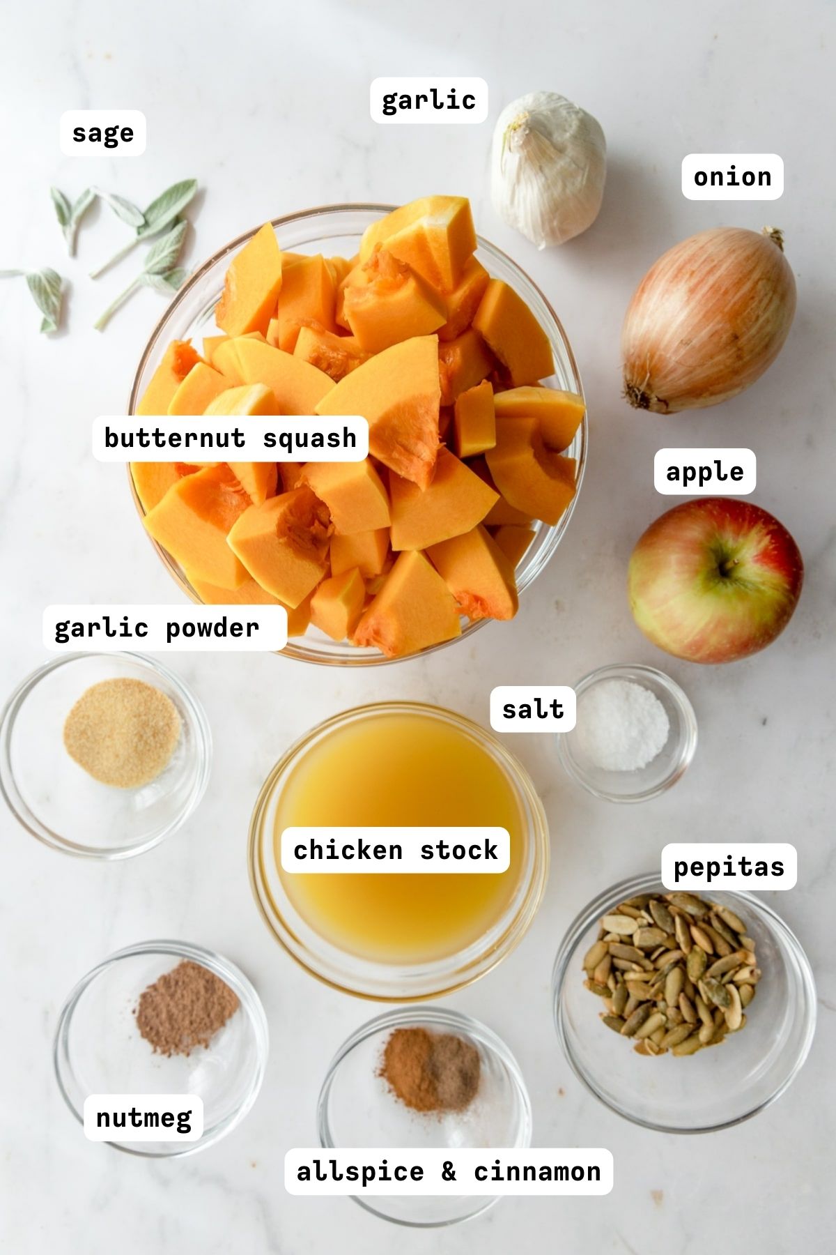 spiced butternut squash soup ingredients in glass mixing bowls.