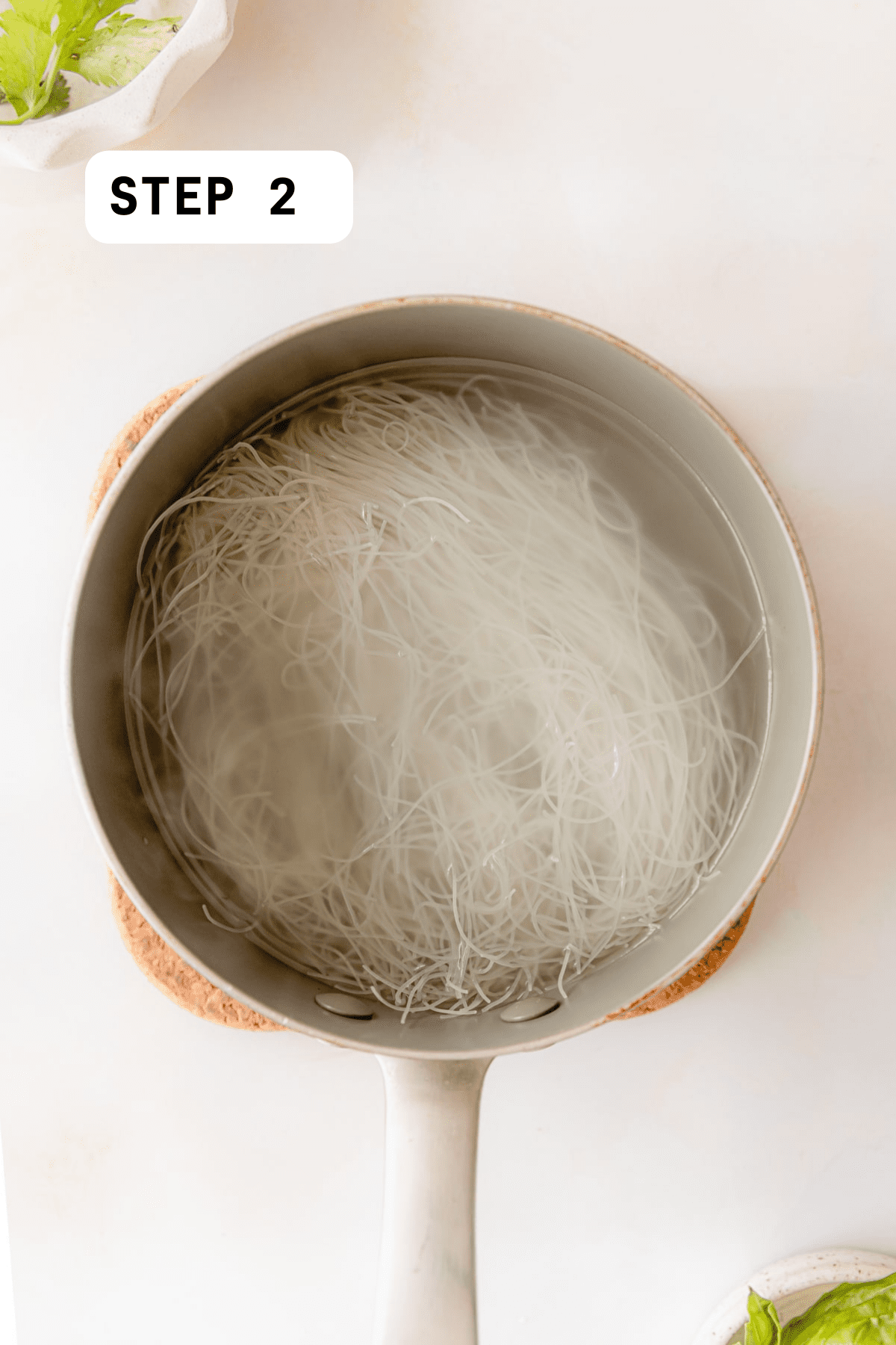 Vermicelli rice noodles boiling in water in a saucepan 