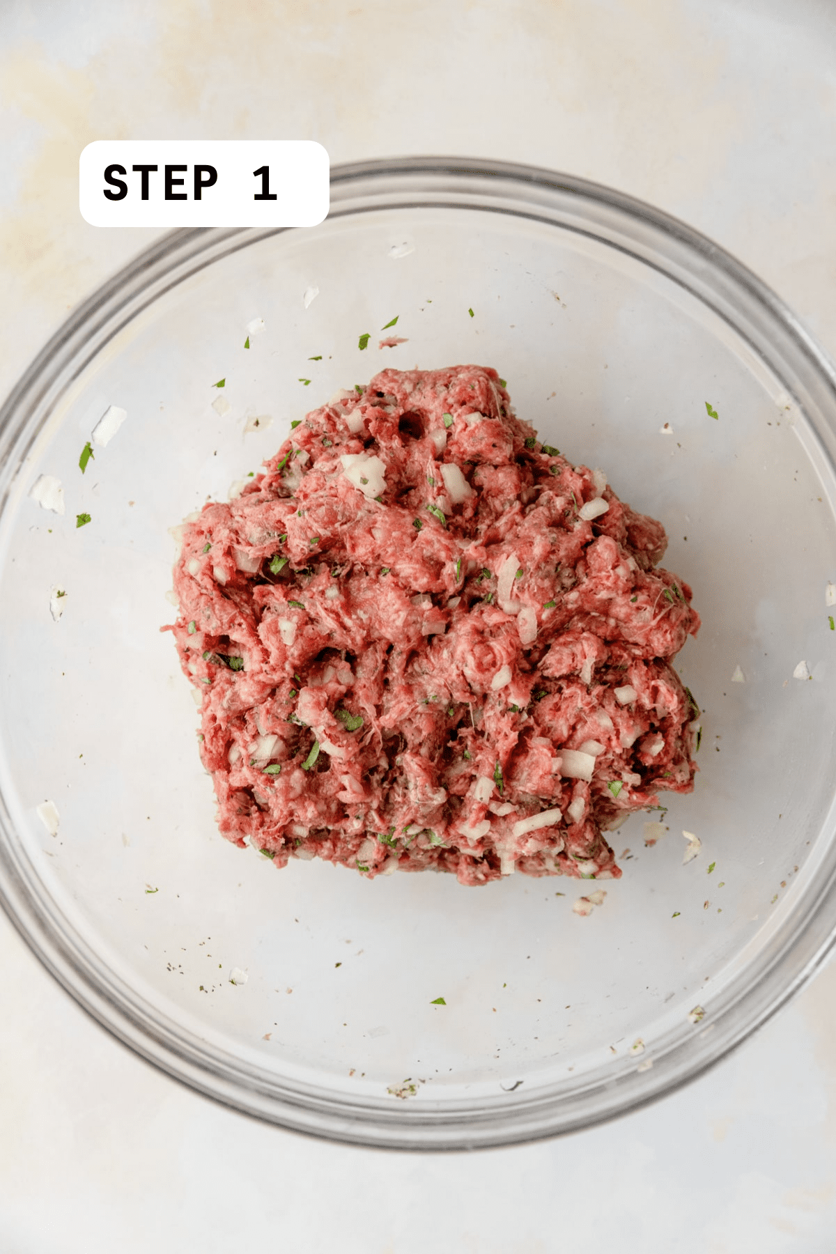 Ground beef mixed with onion, spices, and parsley.