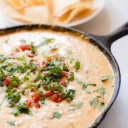 Smoked queso in a cast iron skillet.