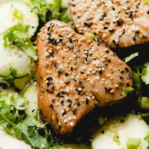 Air fried tuna steak on a bed of greens.