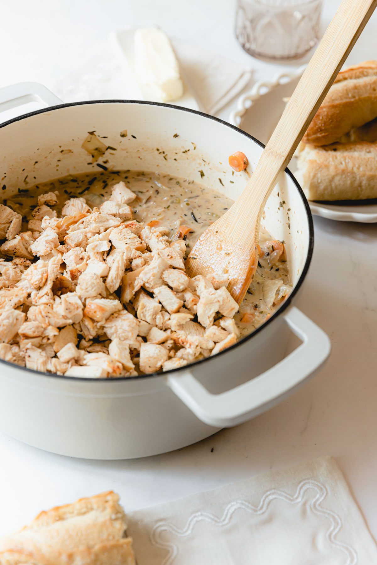 Stirring in chicken to the Panera Chicken and Rice Soup. 