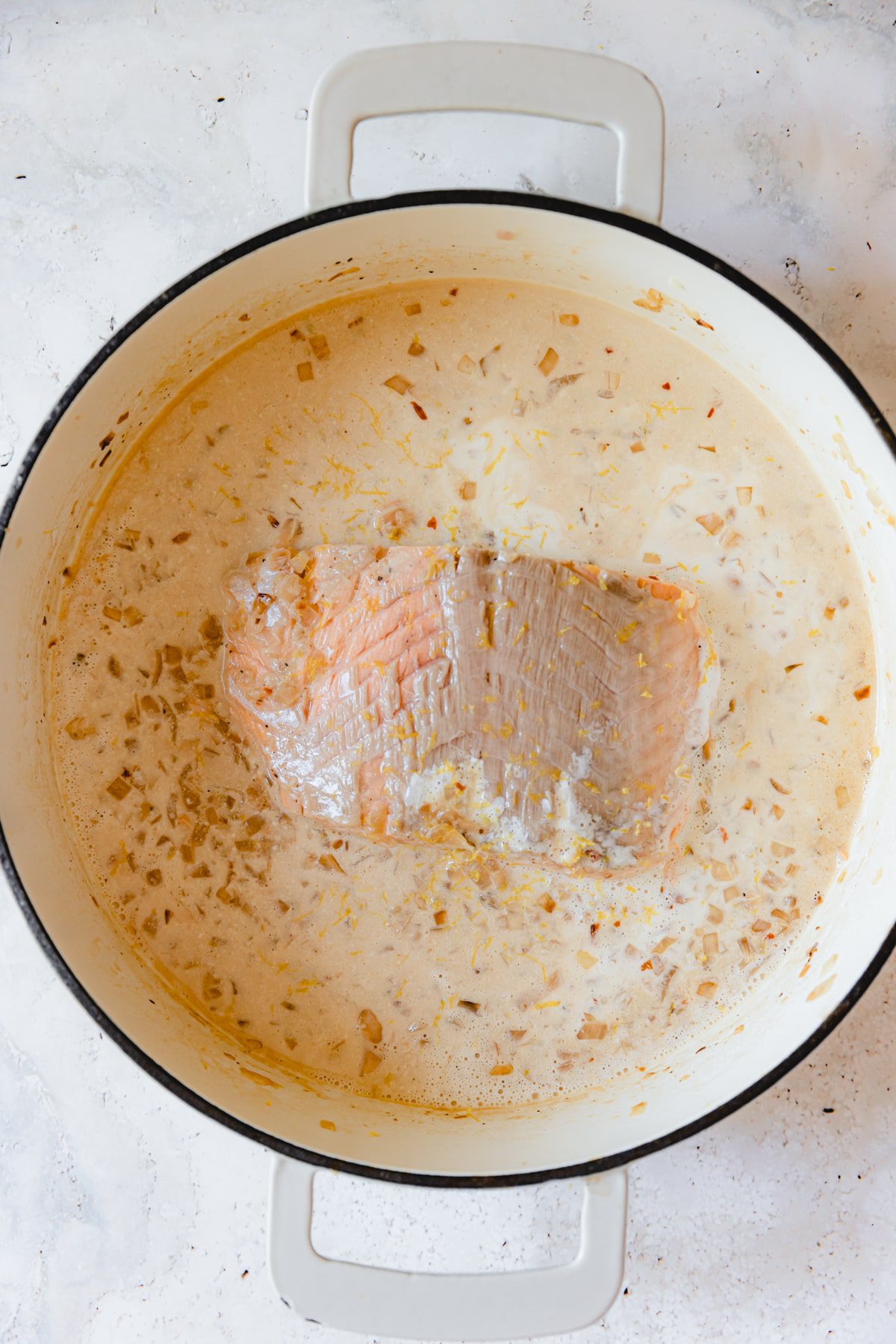 Salmon filet in a lemon cream sauce.