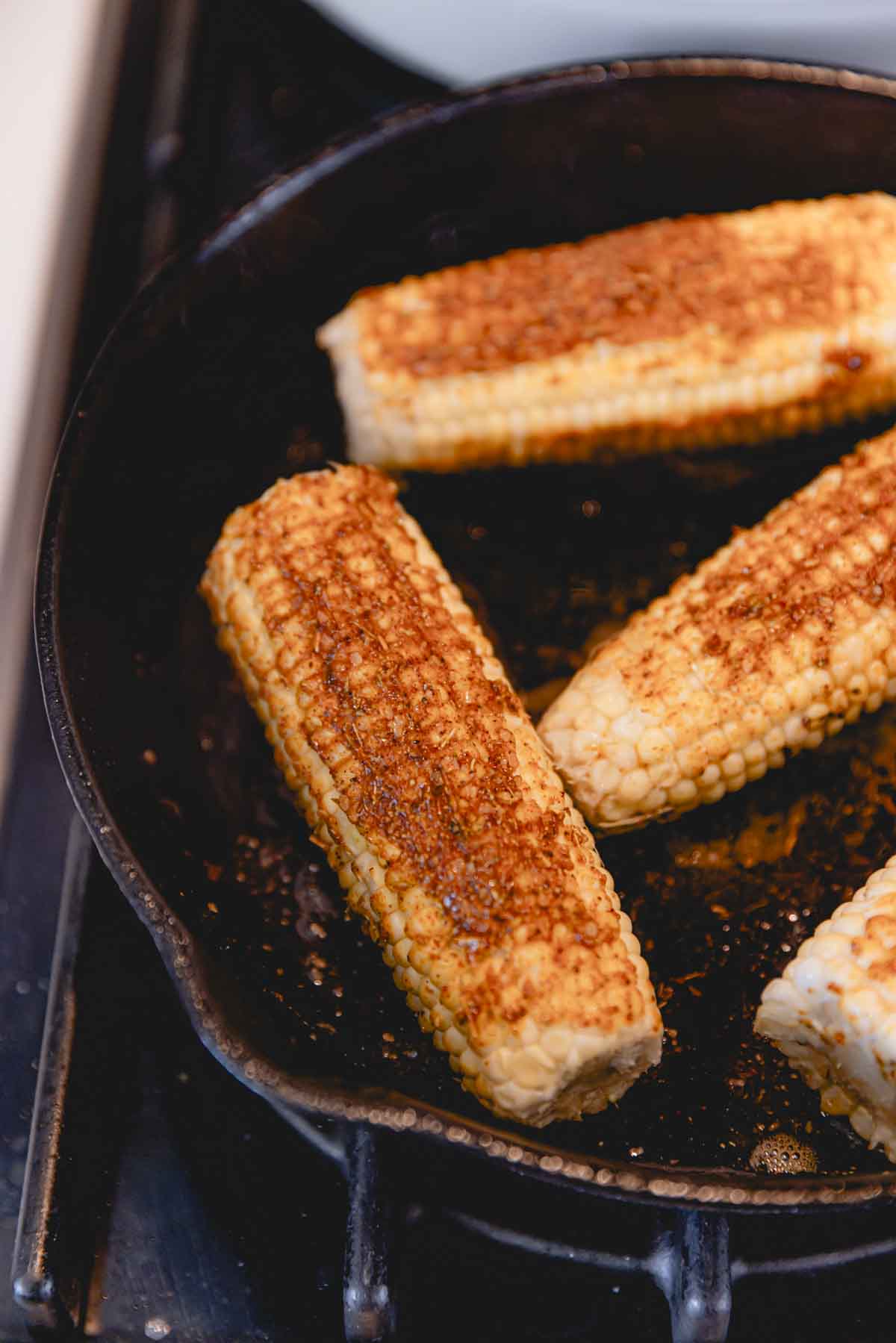 Corn cobs seasoned in a cast iron skillet. 