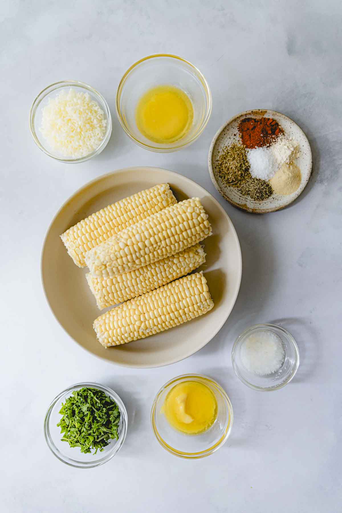 Ingredients for skillet charred corn in glass bowls. 