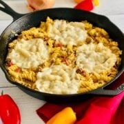 An angled shot of a skillet of Philly cheesesteak pasta.