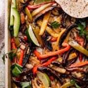 An overhead shot of a pan of portobelleo mushroom fajitas.