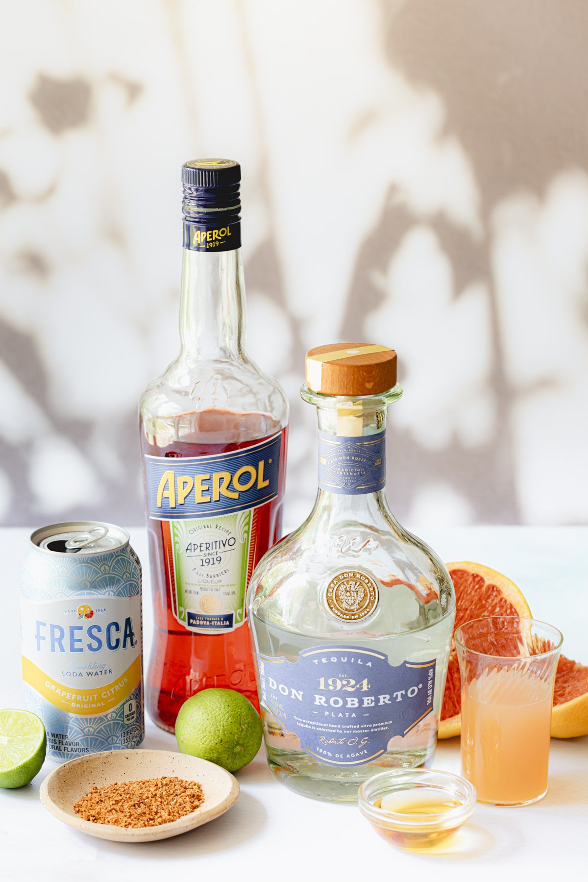 All the ingredients needed to make Aperol Palomas.