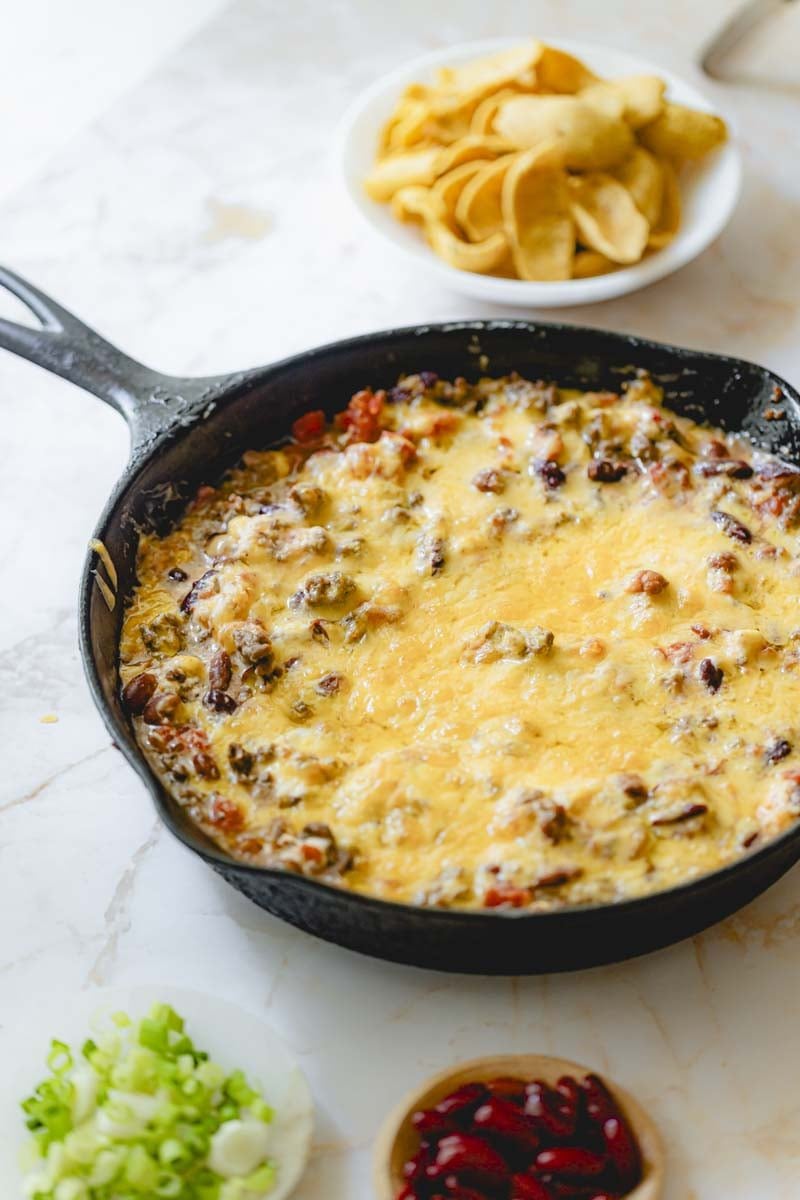 Cooked chili dip in a skillet.