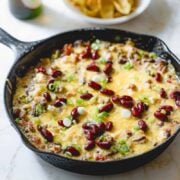 Cooked chili dip in a skillet.