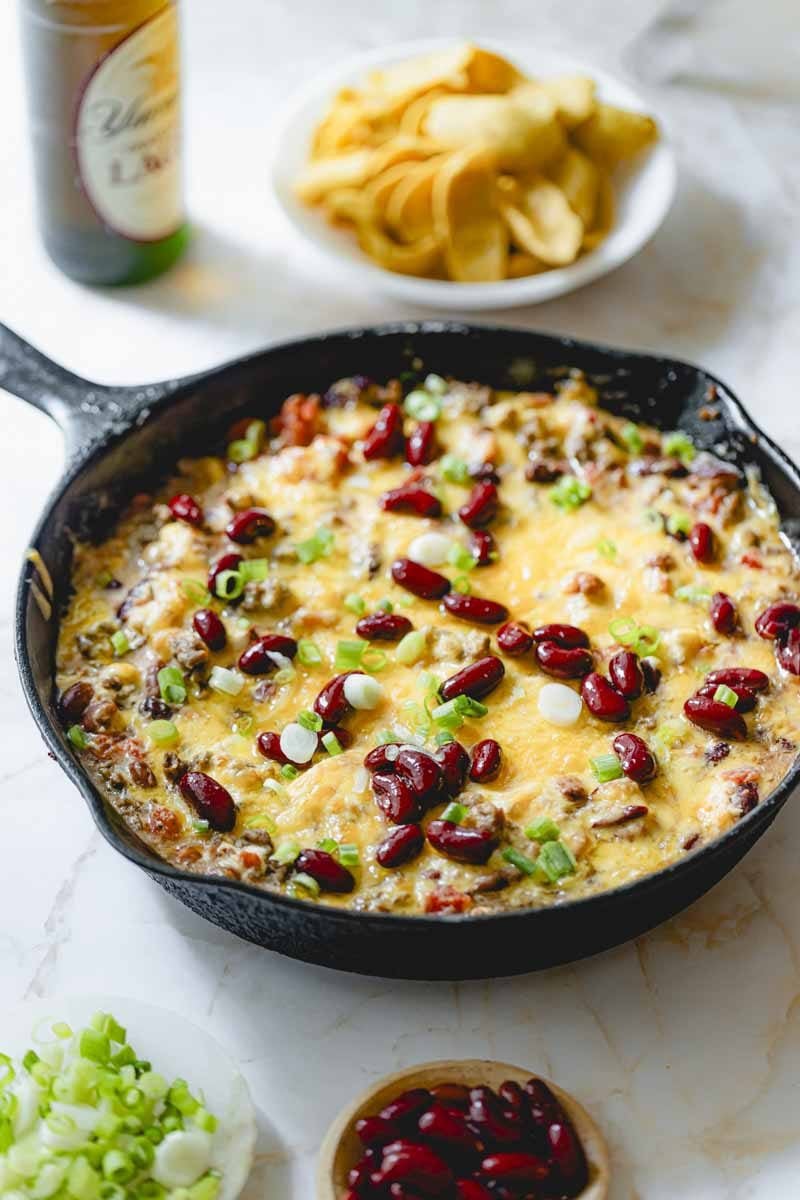 Cooked chili dip in a skillet. 