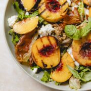 Grilled peaches on an arugula salad with goat cheese.