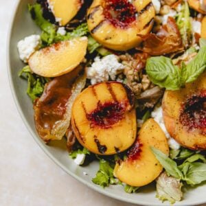 Grilled peaches on an arugula salad with goat cheese.