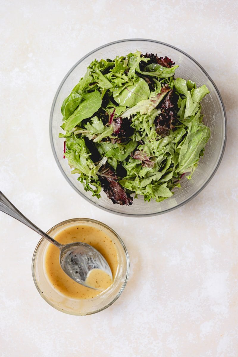 Salad dressing ingredients mixed in a bowl. 