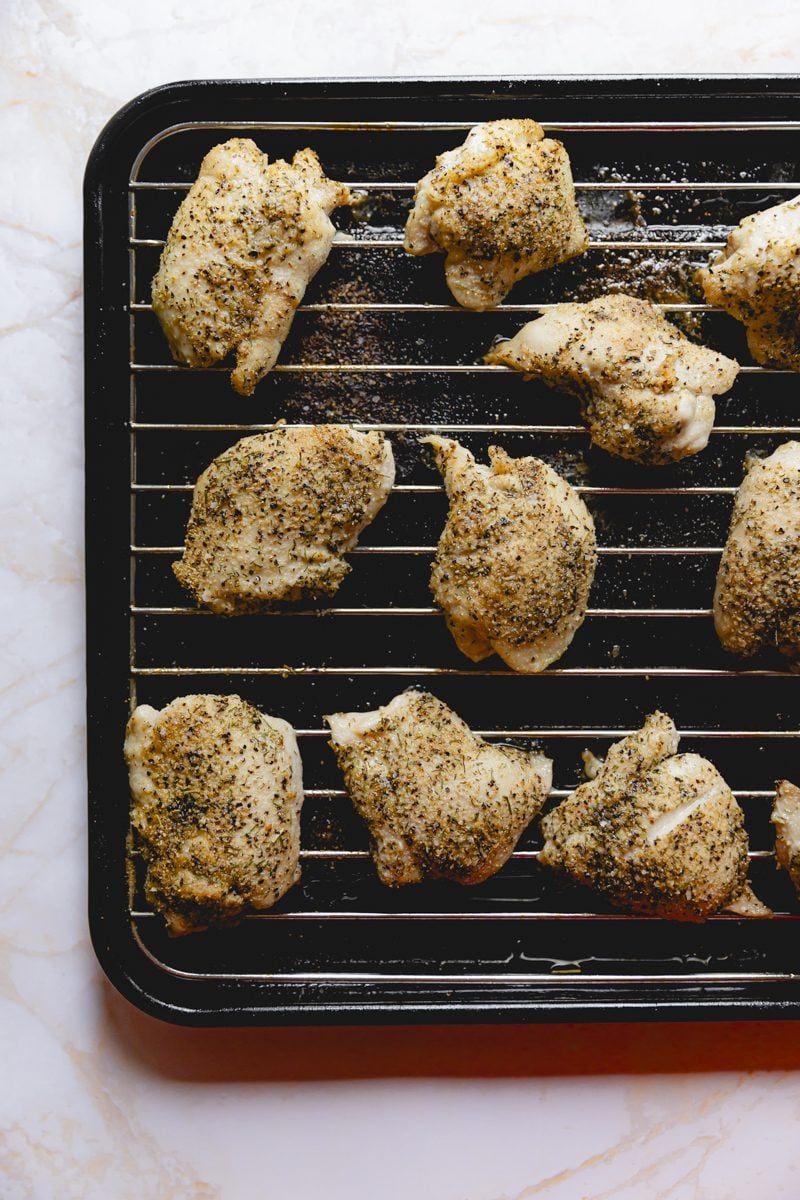 Chicken thighs on sheet tray after being air fried.