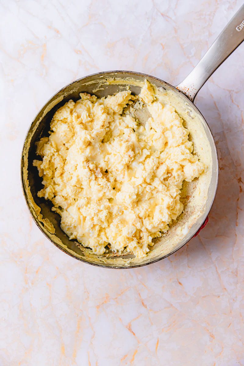 Scrambled eggs in a skillet.