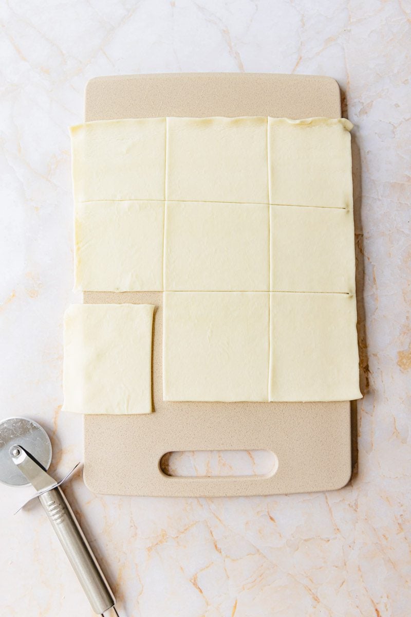 Puff pastry rolled out and cut into 9 squares.