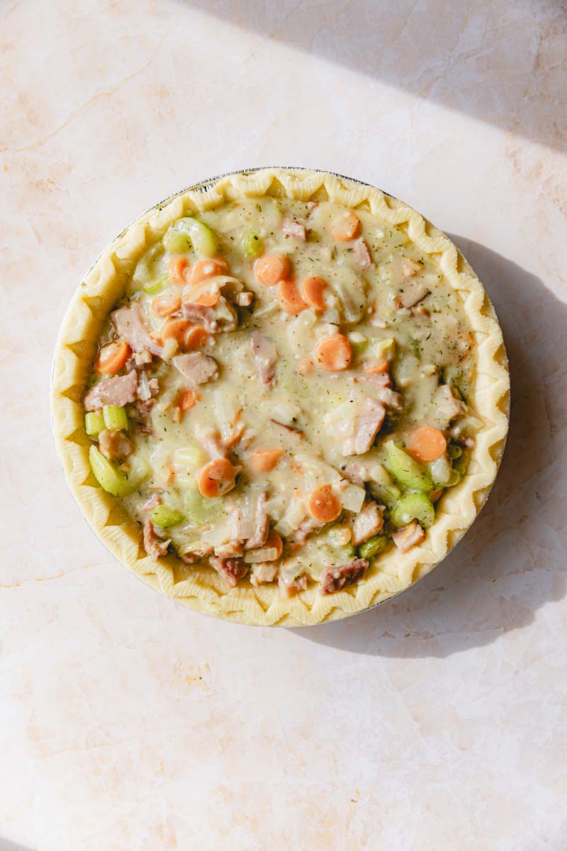 Ham filling poured into pie crust.