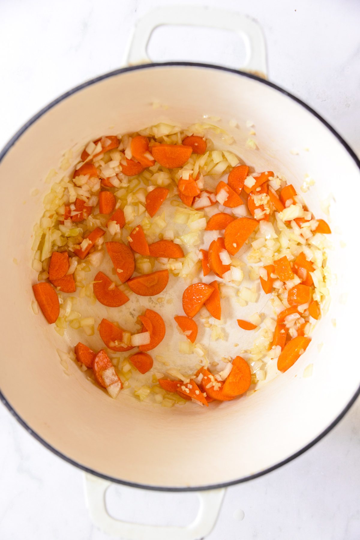 Carrots, onion, and garlic in a dutch oven.