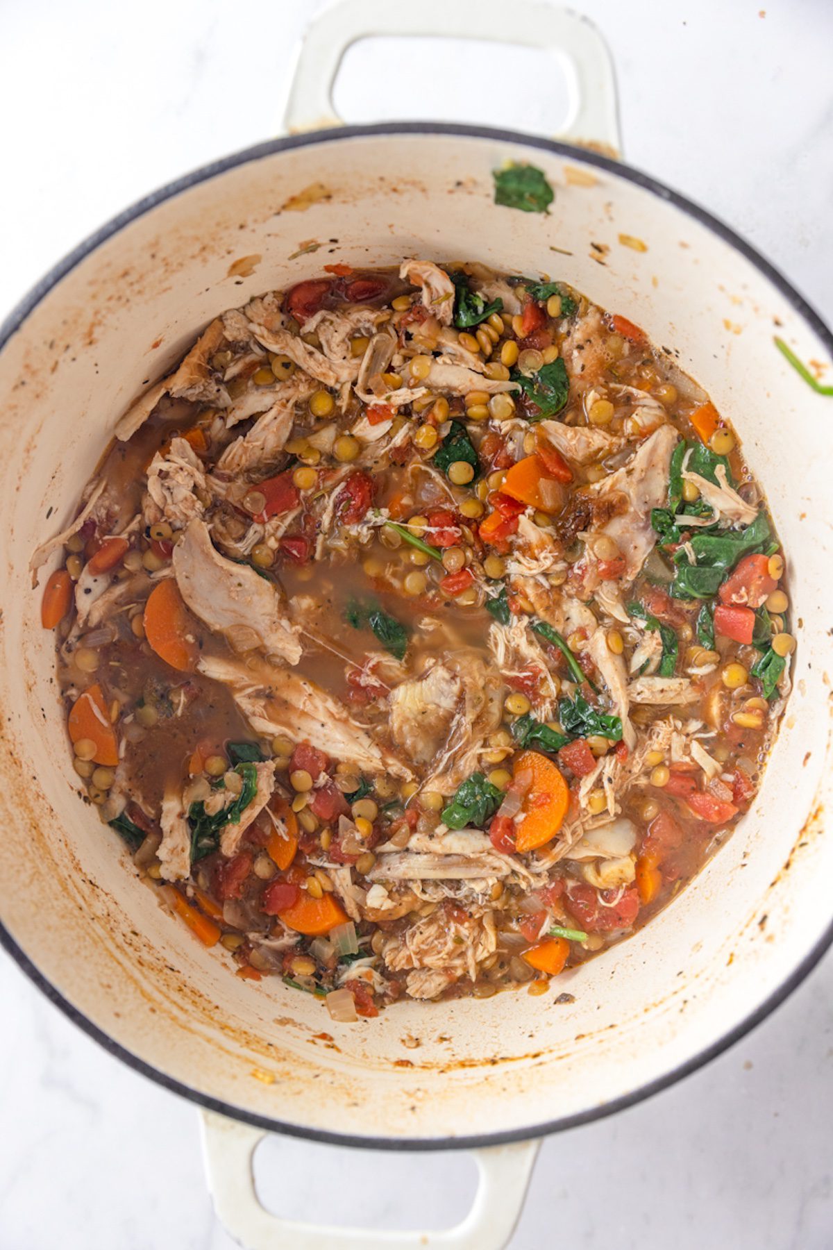 Shredded turkey added into turkey lentil soup.