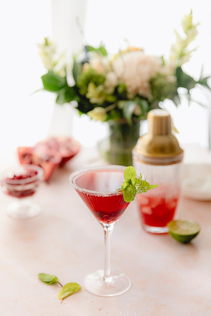 Pomegranate Martini garnished with mint.