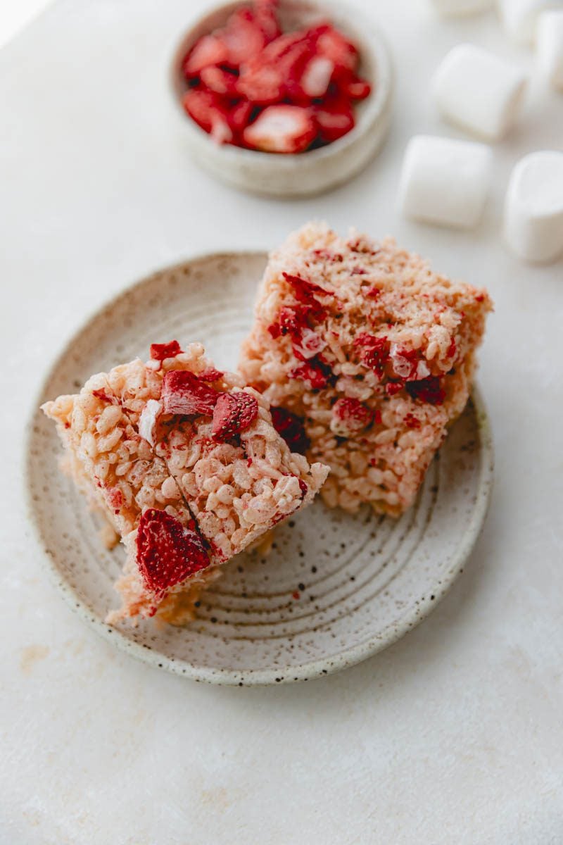 2 pink Rice Krispie treats on a plate.