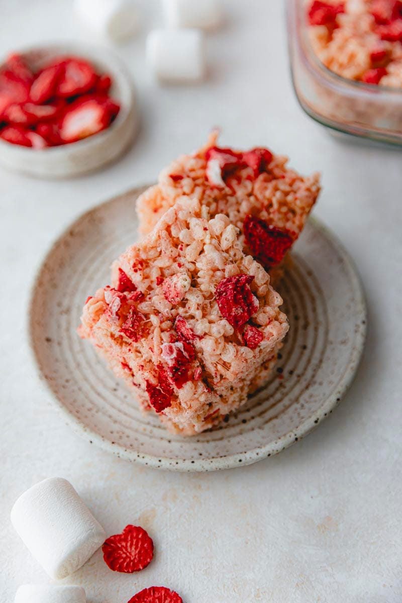 Cut squares of pink Rice Krispie treats.
