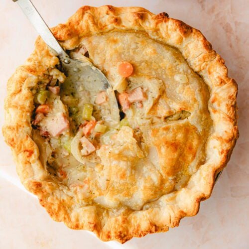 Ham pot pie with a spoon.